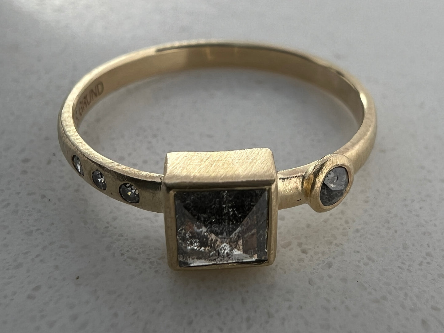 Square Salt and Pepper Black Diamond Engagement Ring with a low bezel and accented with rose-cut and flush-set diamonds