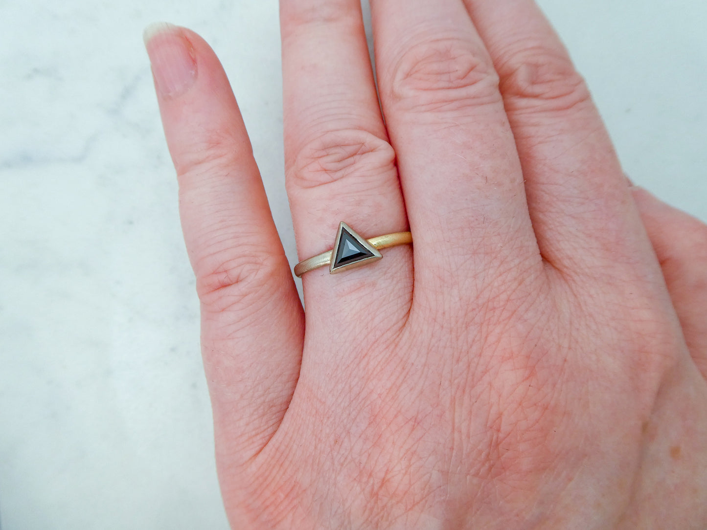 Black rose-cut triangle diamond .48ct bezel-set two-tone engagement ring in 14k white and yellow gold with a low dome 2mm 50/50 partnership band, size8.5