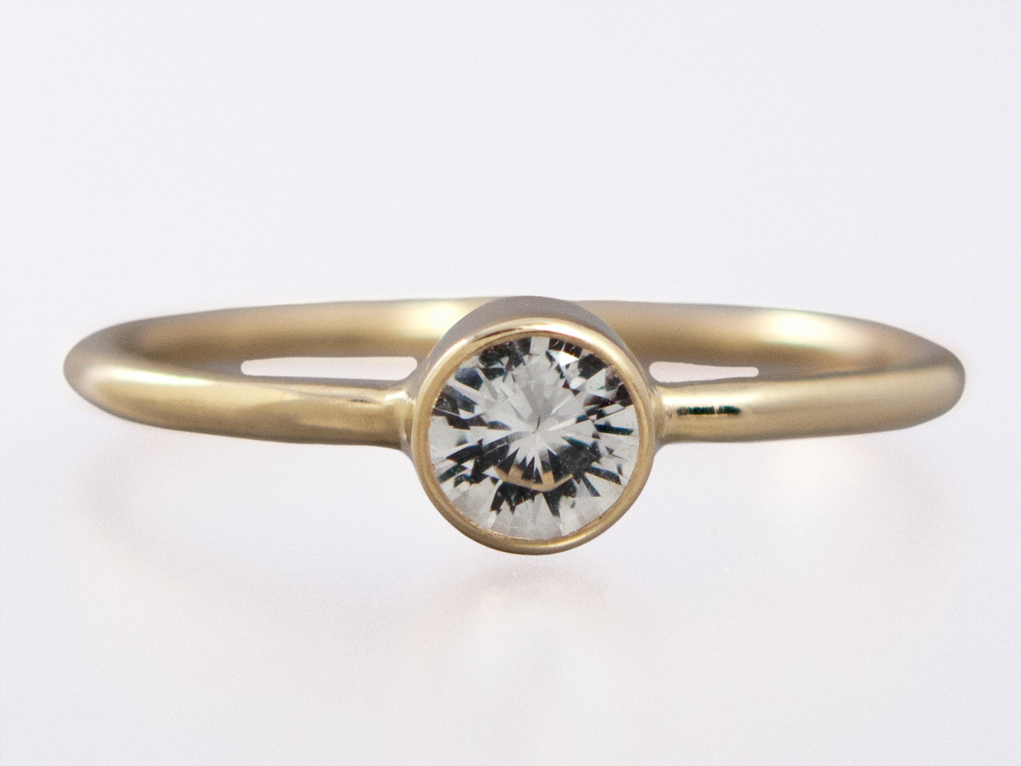 Moissanite Engagement Ring with a Delicate 1.3mm Round and 3mm-6mm Solitaire Straight Bezel in 14k Gold