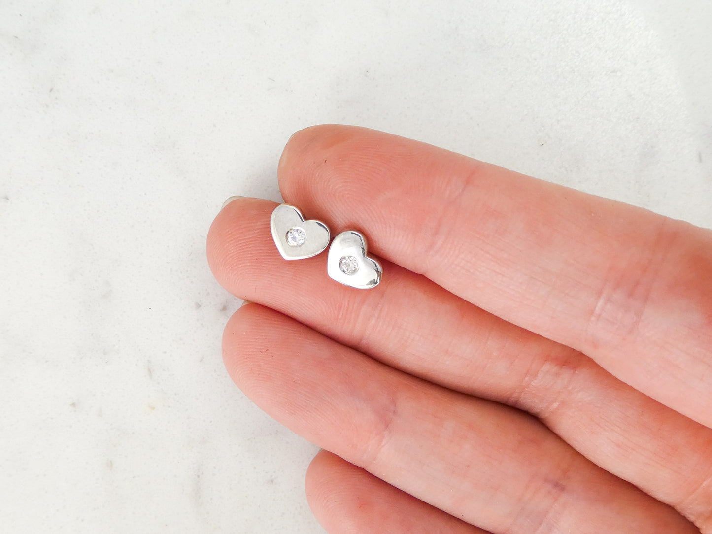 Diamond and Heart Studs in Sterling Silver, sweet heart shapes earrings with flush-set diamond accents