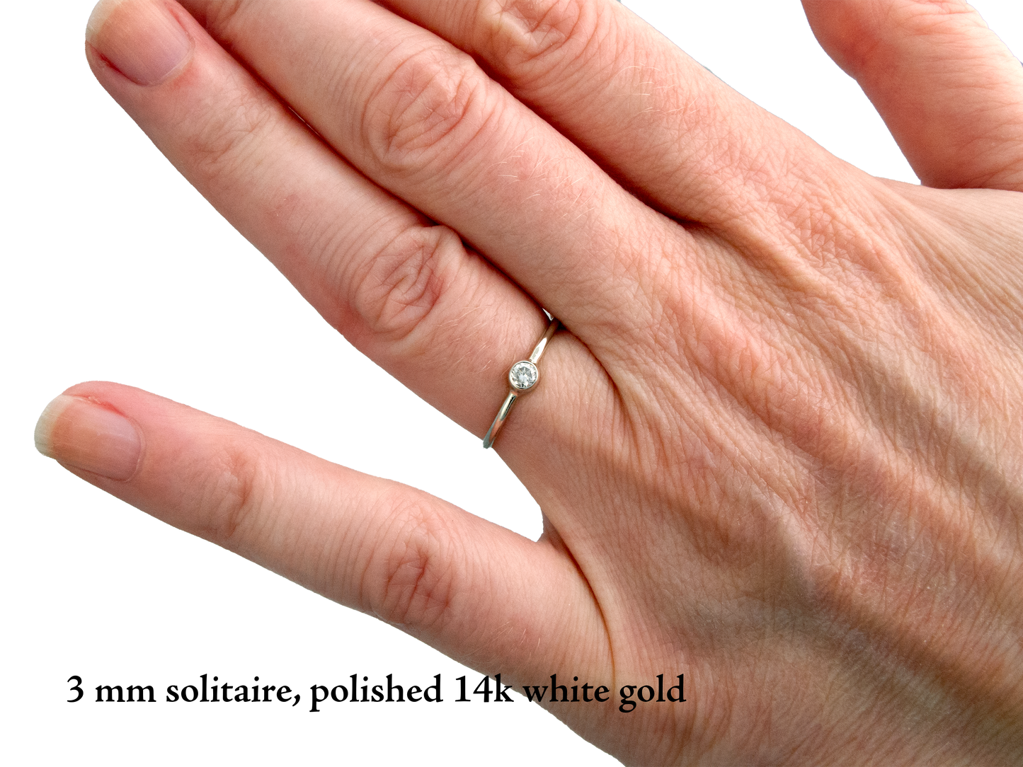 Moissanite Engagement Ring with a Delicate 1.3mm Round and 3mm-6mm Solitaire Straight Bezel in 14k Gold