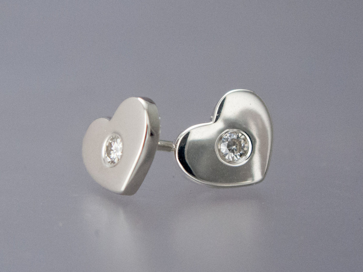 Diamond and Heart Studs in Sterling Silver, sweet heart shapes earrings with flush-set diamond accents