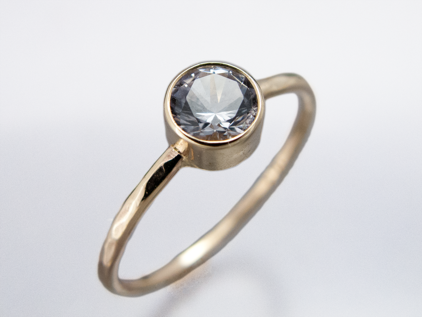 Moissanite Engagement Ring with a Delicate 1.3mm Round and 3mm-6mm Solitaire Straight Bezel in 14k Gold