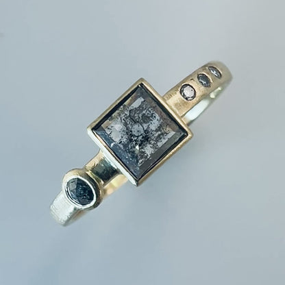 Square Salt and Pepper Black Diamond Engagement Ring with a low bezel and accented with rose-cut and flush-set diamonds