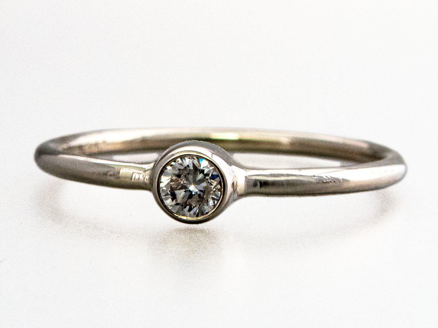 Moissanite Engagement Ring with a Delicate 1.3mm Round and 3mm-6mm Solitaire Straight Bezel in 14k Gold