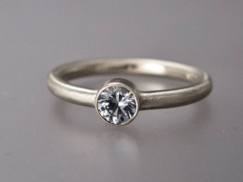 White Sapphire Engagement Ring | 3mm-6mm Solitaire Ring with Straight Bezel and a Classic 2mm Round Band in Gold or Platinum